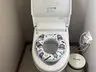 Child-size toilet seat fitted over the washlet